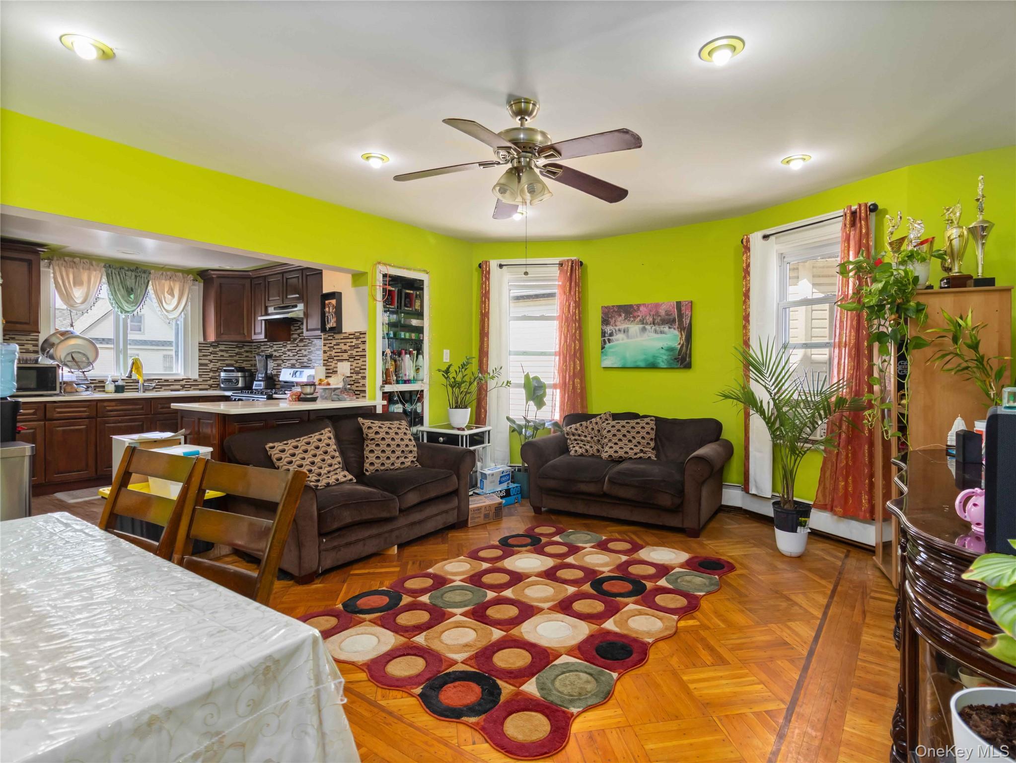 91-16 115th Street Queens, NY 11418 - Photo 9 of 19 a living room with furniture and a flat screen tv