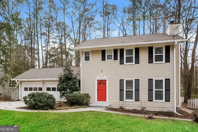 a view of empty room with window and fireplace