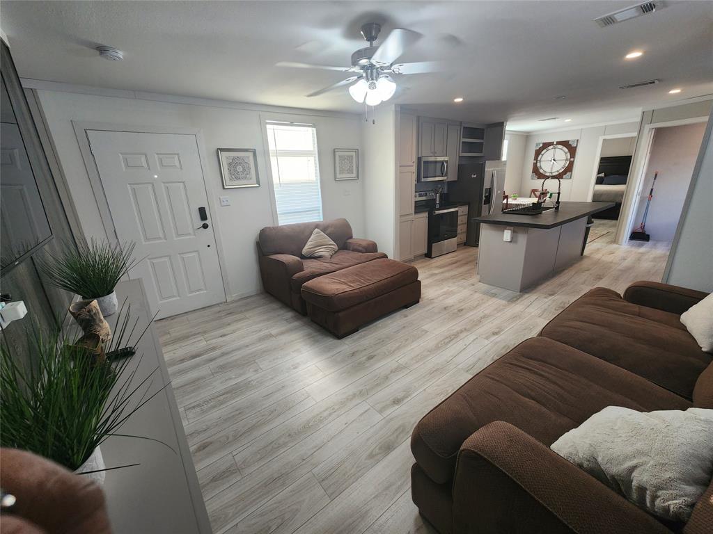 108 Piper Path Pearland, TX 77581 - Photo 1 of 41 a living room with furniture and wooden floor