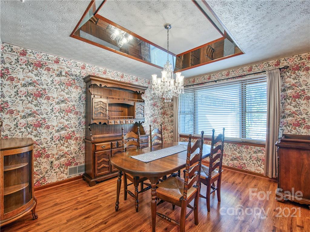 17 Royal Ridge Road Clyde, NC 28721 - Photo 20 of 38 a view of a dining room with furniture and wooden floor