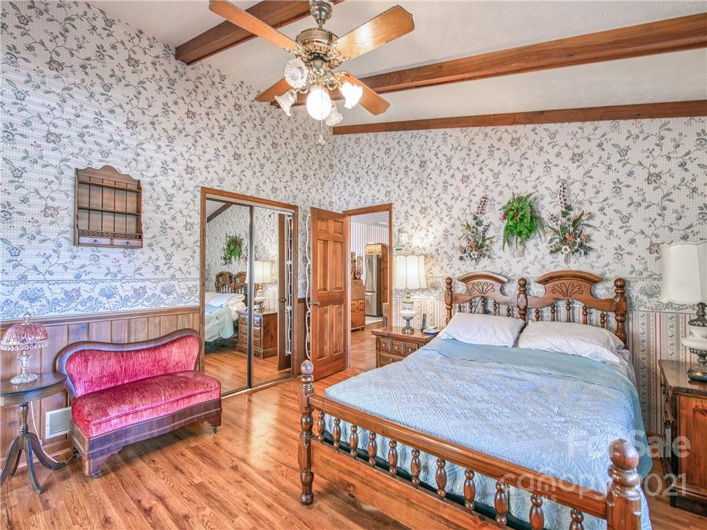 17 Royal Ridge Road Clyde, NC 28721 - Photo 21 of 38 a bedroom with furniture and wooden floor