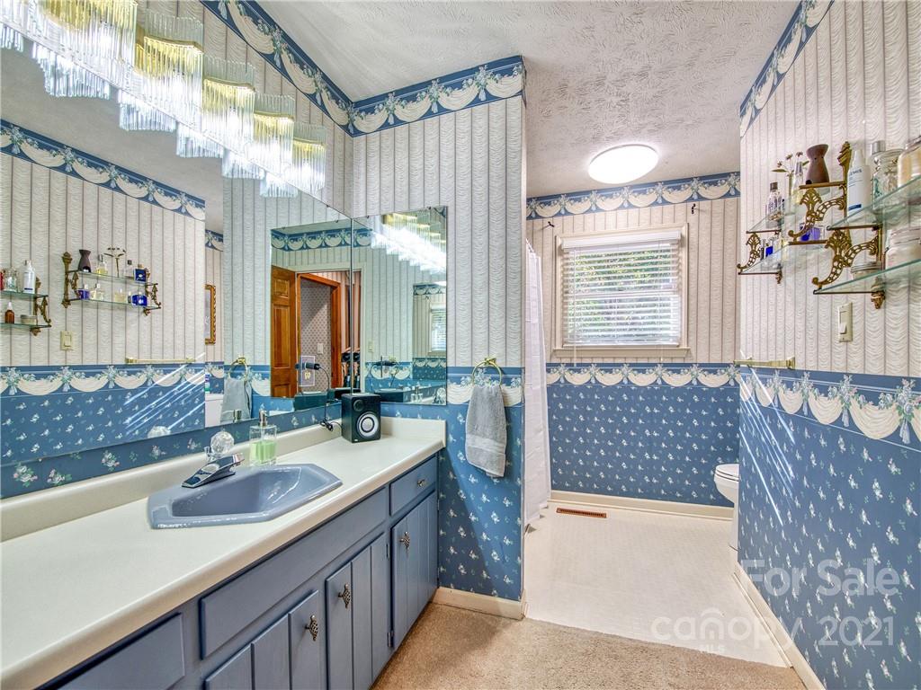 17 Royal Ridge Road Clyde, NC 28721 - Photo 26 of 38 a bathroom with a double vanity sink mirror and shower