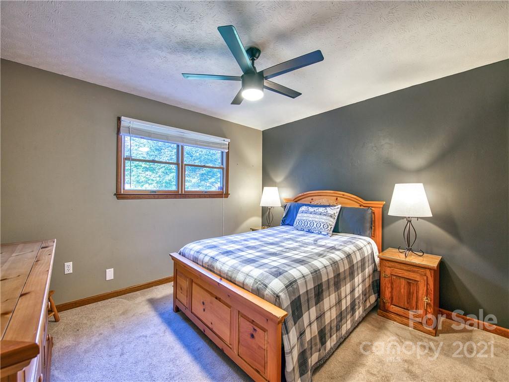 17 Royal Ridge Road Clyde, NC 28721 - Photo 27 of 38 a bedroom with a bed and window