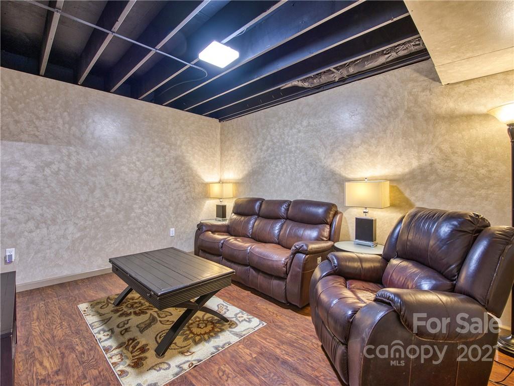 17 Royal Ridge Road Clyde, NC 28721 - Photo 31 of 38 a living room with a couch and a rug