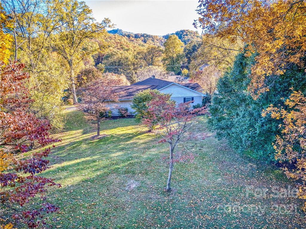 17 Royal Ridge Road Clyde, NC 28721 - Photo 7 of 38 a view of a house with a backyard