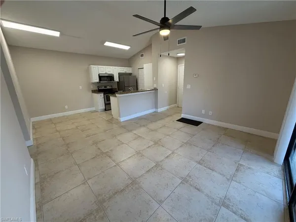 a view of a kitchen with a sink