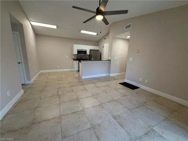 a view of kitchen with furniture and a window