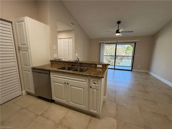 a kitchen with a sink stove and refrigerator