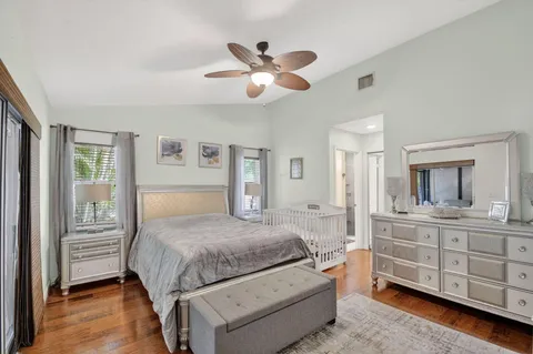 a bedroom with a large bed and a tv