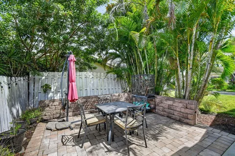 a table and chairs sitting in the garden