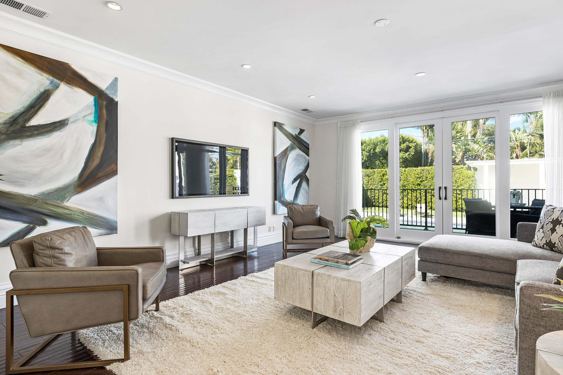506 North Crescent Drive Beverly Hills, CA 90210 - Photo 11 of 36 a living room with furniture and a large window