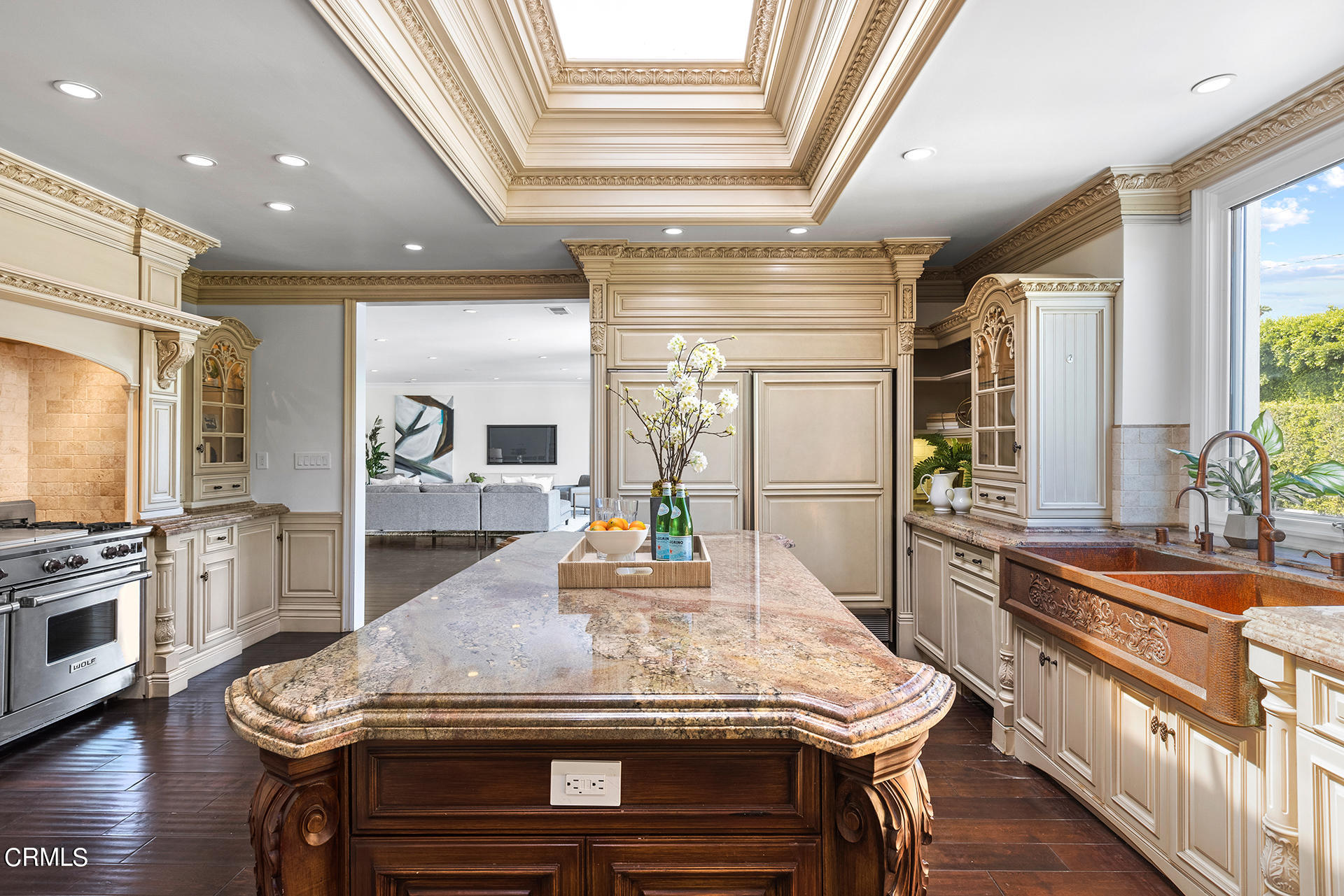 506 North Crescent Drive Beverly Hills, CA 90210 - Photo 16 of 36 a kitchen with kitchen island granite countertop wooden floor and stainless steel appliances