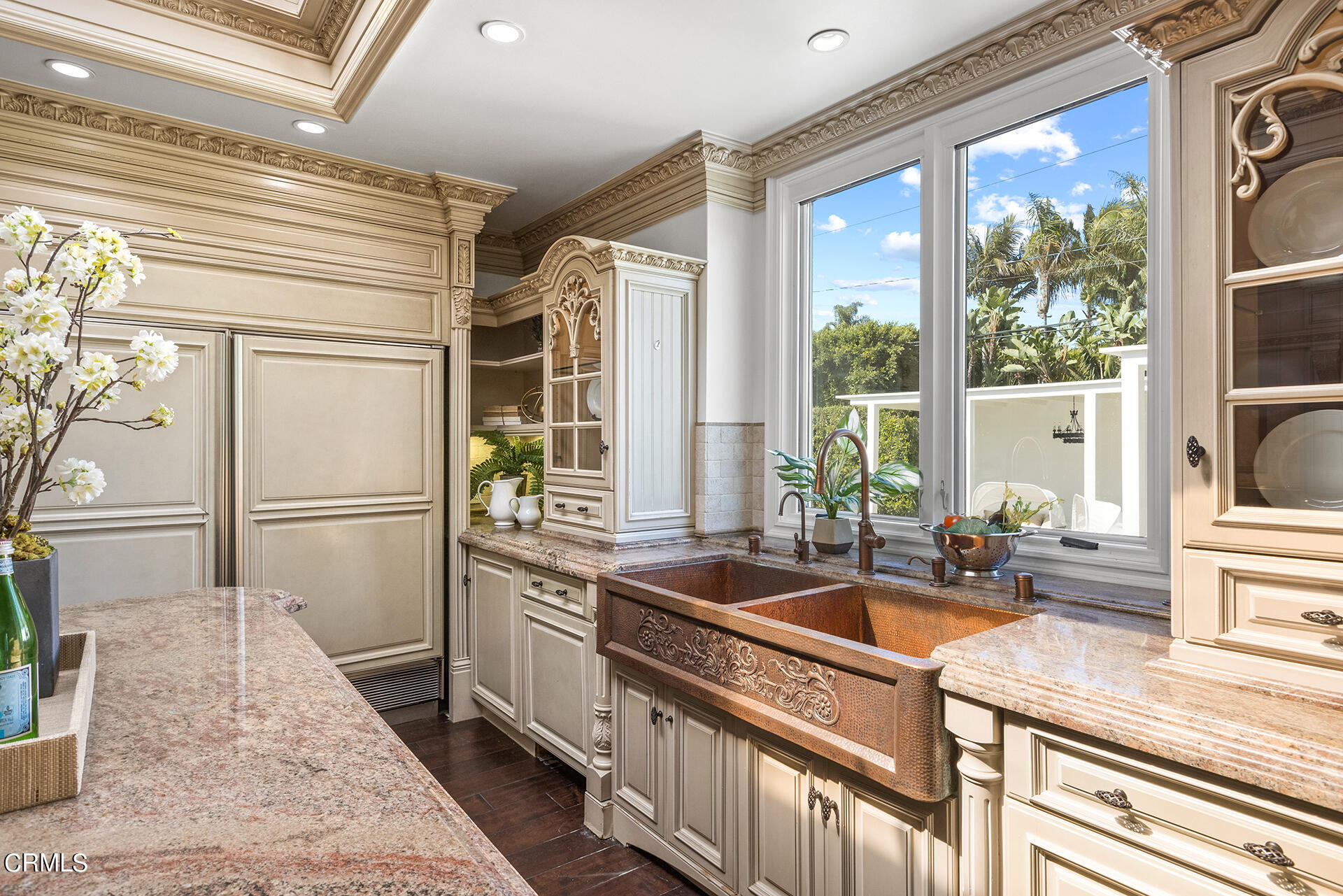 506 North Crescent Drive Beverly Hills, CA 90210 - Photo 17 of 36 a kitchen that has a sink a stove and a refrigerator