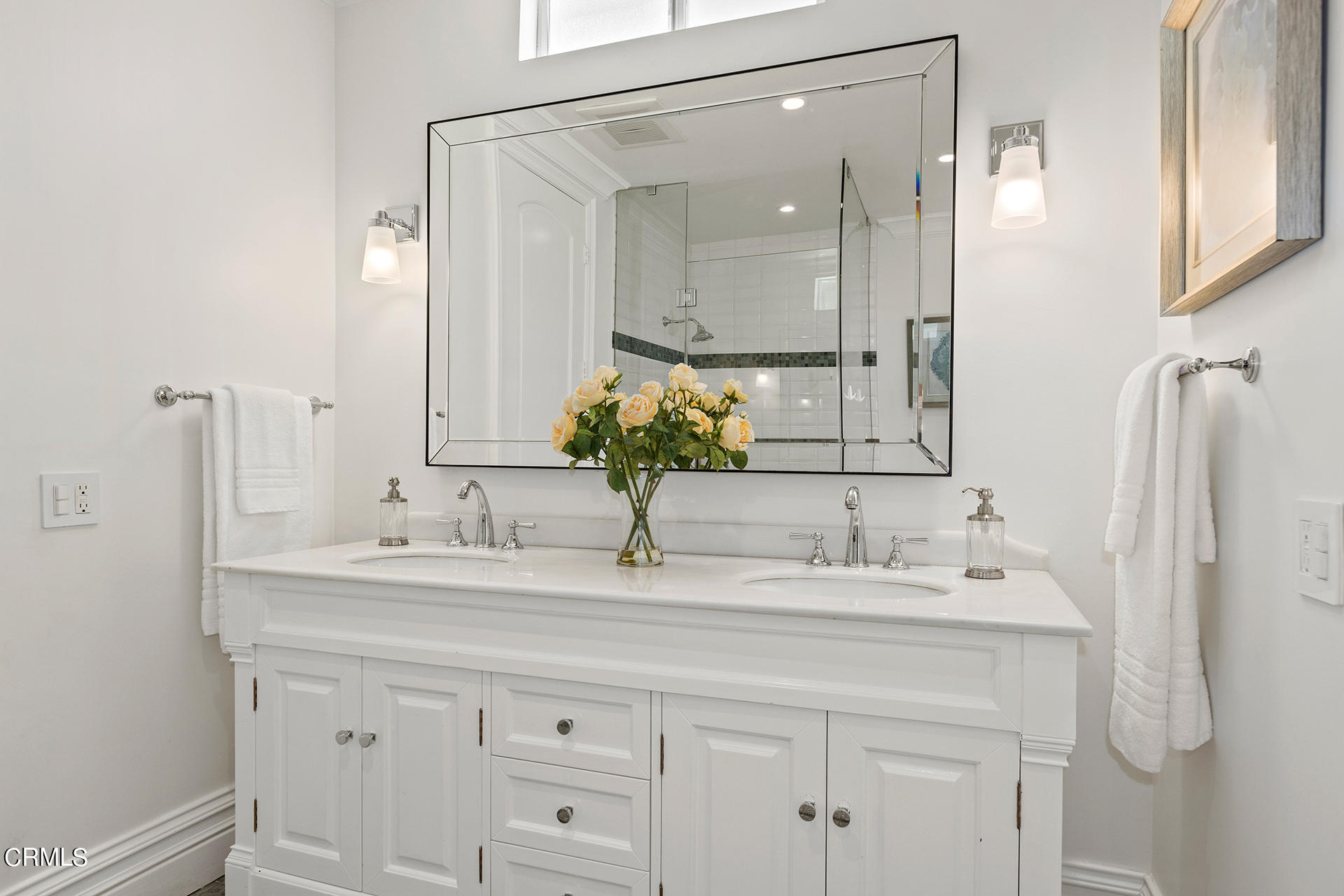 506 North Crescent Drive Beverly Hills, CA 90210 - Photo 24 of 36 a bathroom with a sink and a mirror