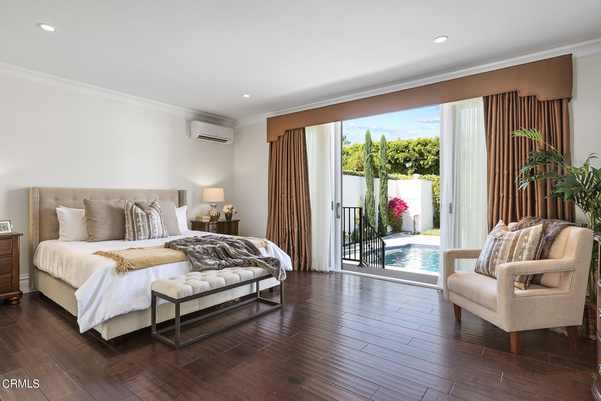 506 North Crescent Drive Beverly Hills, CA 90210 - Photo 25 of 36 a spacious bedroom with a bed and glass window