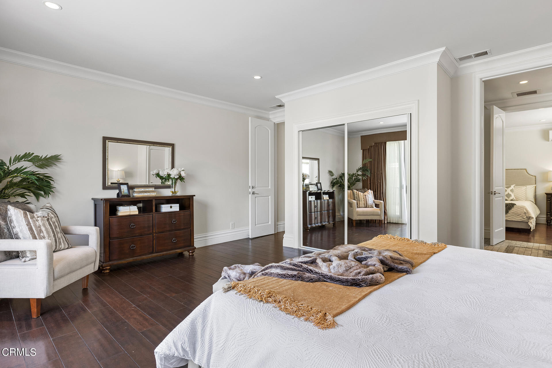 506 North Crescent Drive Beverly Hills, CA 90210 - Photo 26 of 36 a bedroom with a bed and wooden floor