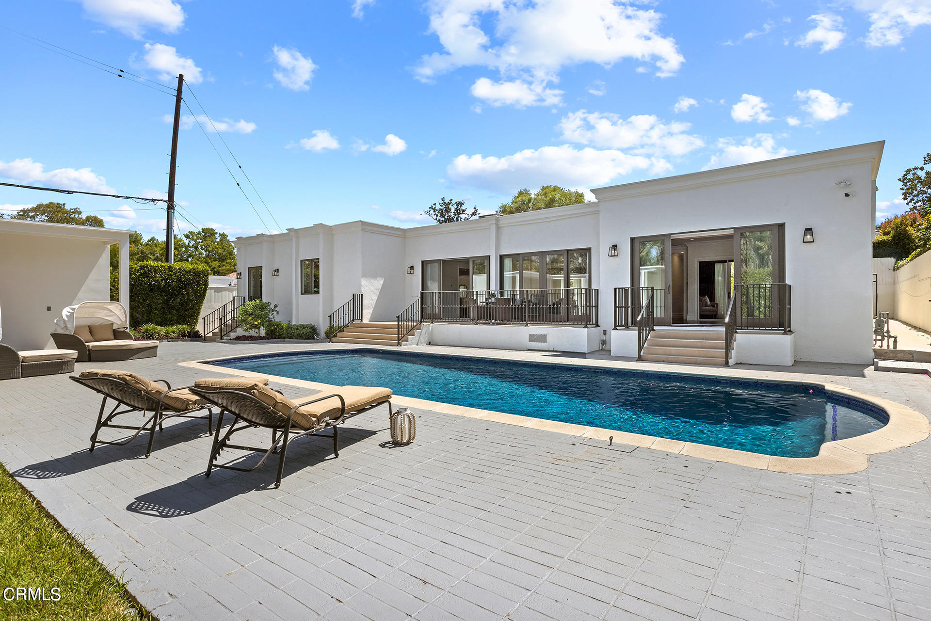 506 North Crescent Drive Beverly Hills, CA 90210 - Photo 32 of 36 a living room with furniture a rug and a chandelier