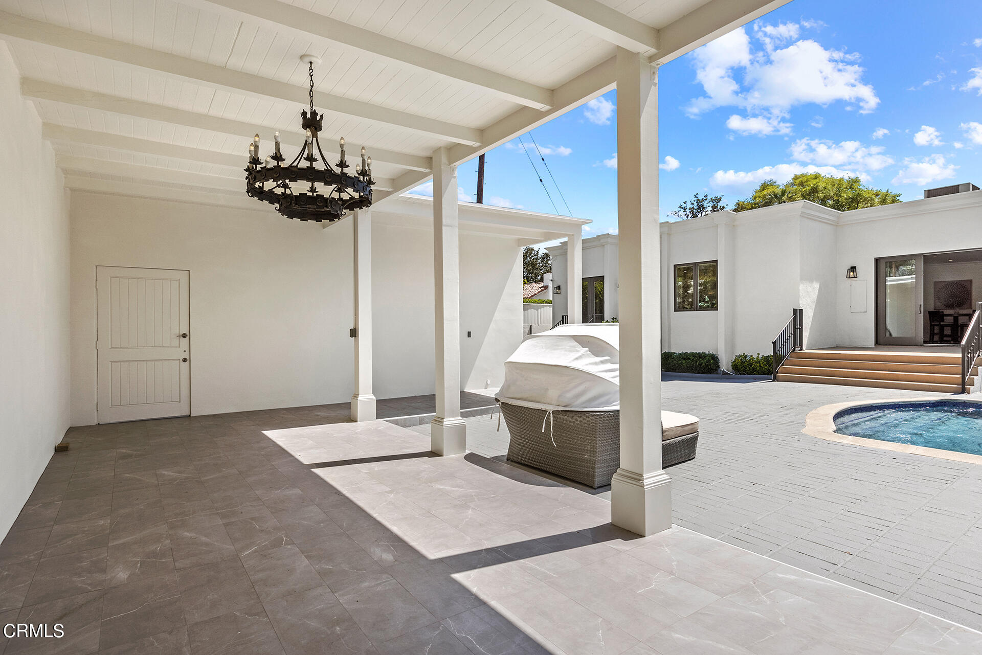 506 North Crescent Drive Beverly Hills, CA 90210 - Photo 35 of 36 a view of a livingroom with furniture and chandelier
