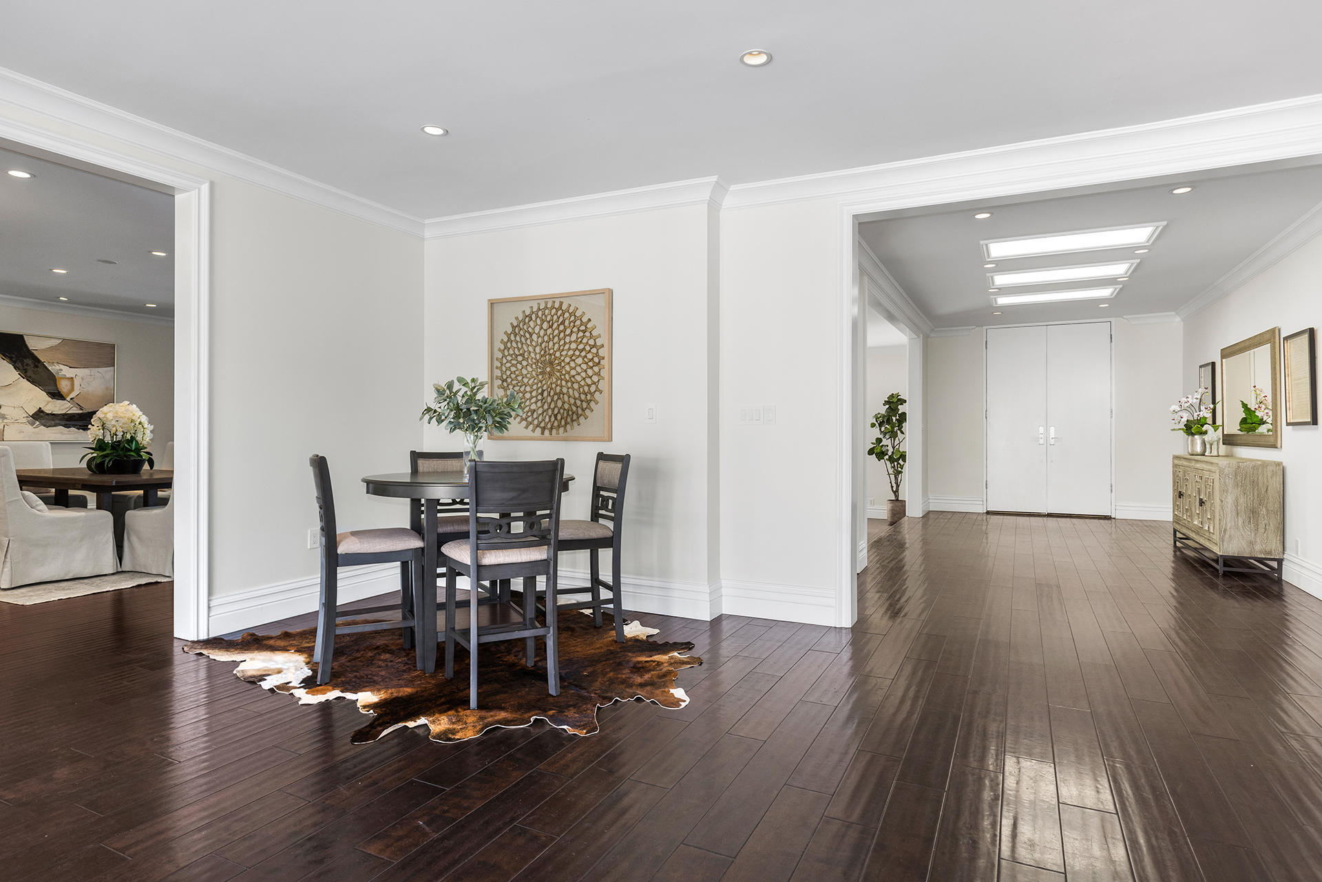 506 North Crescent Drive Beverly Hills, CA 90210 - Photo 9 of 36 a view of a dining room with furniture and wooden floor