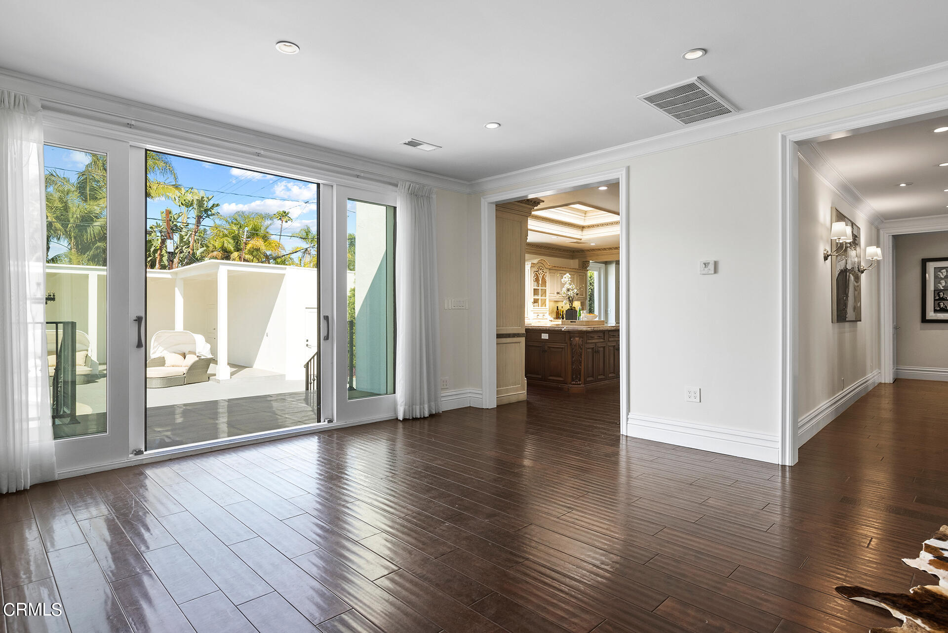 506 North Crescent Drive Beverly Hills, CA 90210 - Photo 10 of 36 an empty room with wooden floor and windows