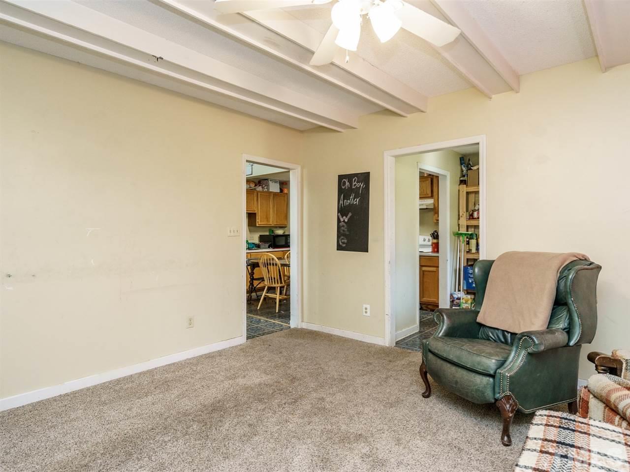 538 Brent Road Raleigh, NC 27606 - Photo 3 of 13 a living room with furniture and a chair
