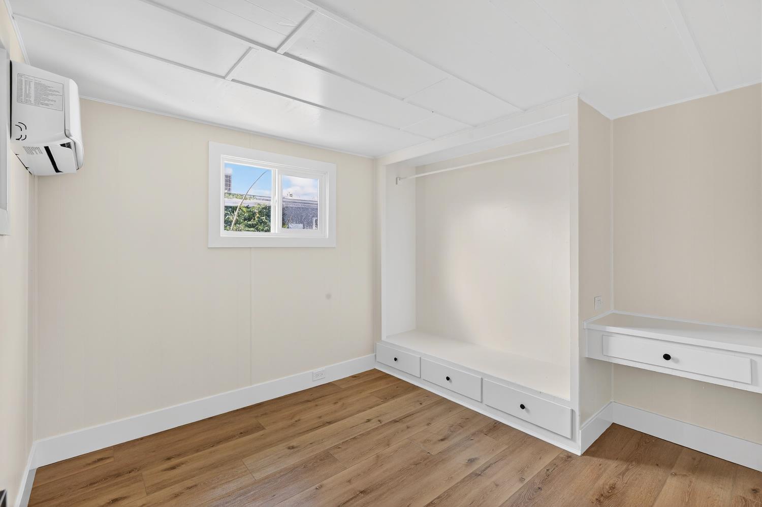 3435 Marfargoa, Unit 48 Stockton, CA 95215 - Photo 17 of 22 a view of an empty room with wooden floor