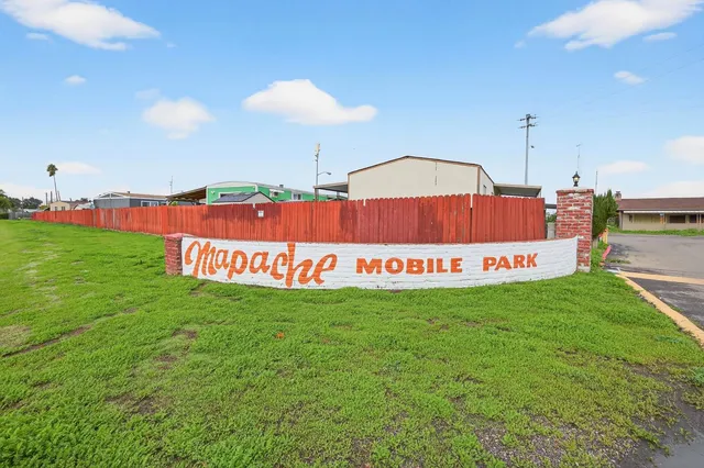 a sign that is sitting in the grass