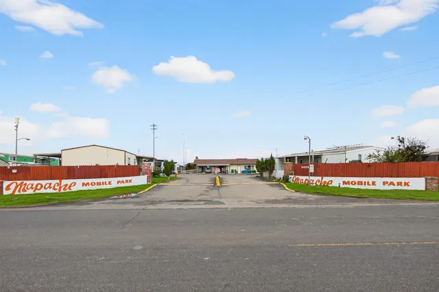 a view of a bench in front of a building