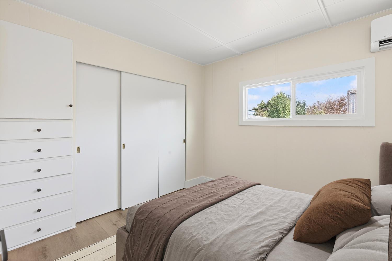 3435 Marfargoa, Unit 48 Stockton, CA 95215 - Photo 6 of 22 a bedroom with a bed and a cabinet