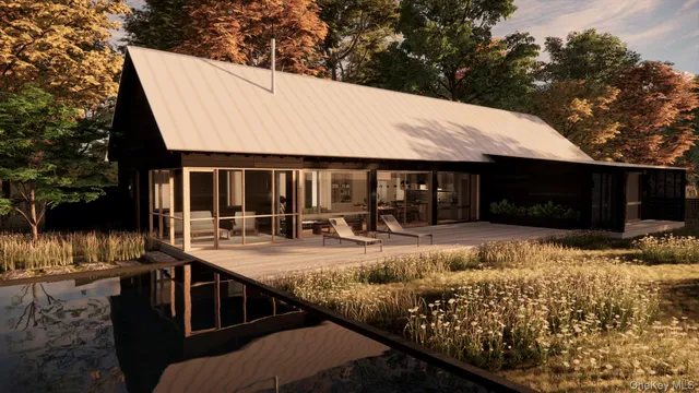 a view of house with outdoor space and sitting area