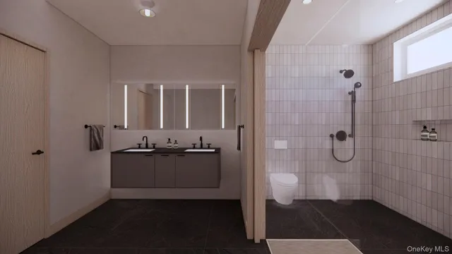 a bathroom with a granite countertop sink a mirror and a shower