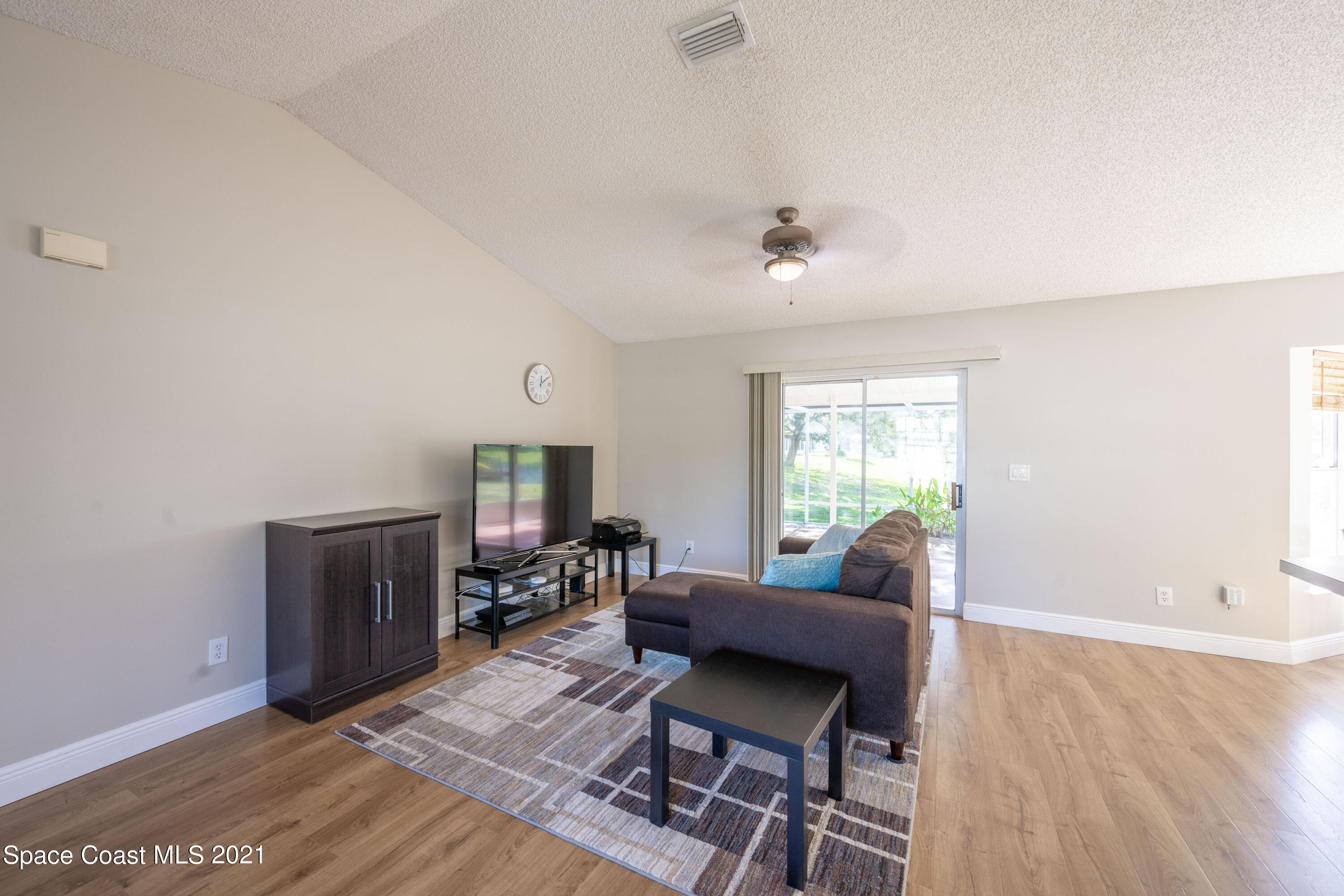 265 Oak Lake Road Melbourne, FL 32901 - Photo 14 of 25 a living room with furniture and a window