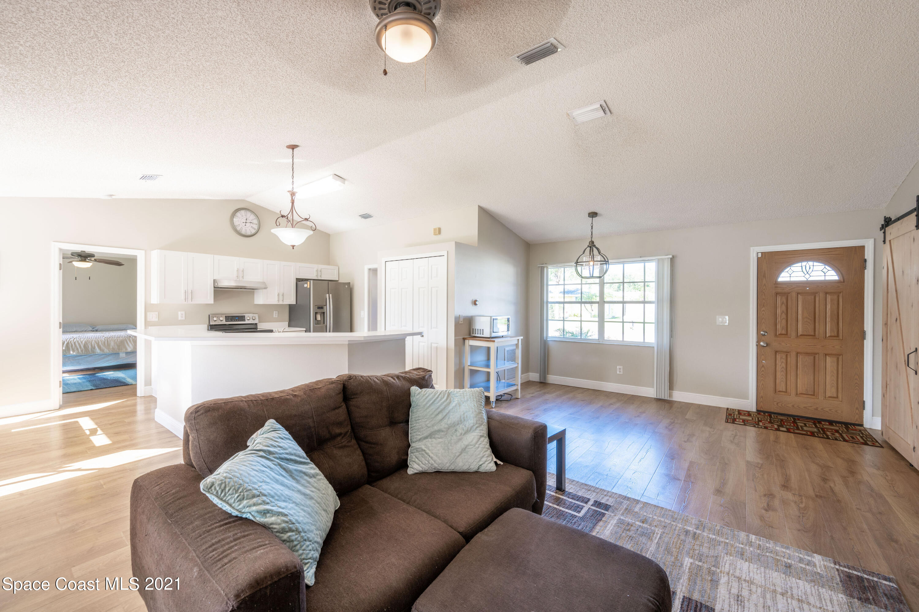 265 Oak Lake Road Melbourne, FL 32901 - Photo 15 of 25 a living room with furniture and wooden floor