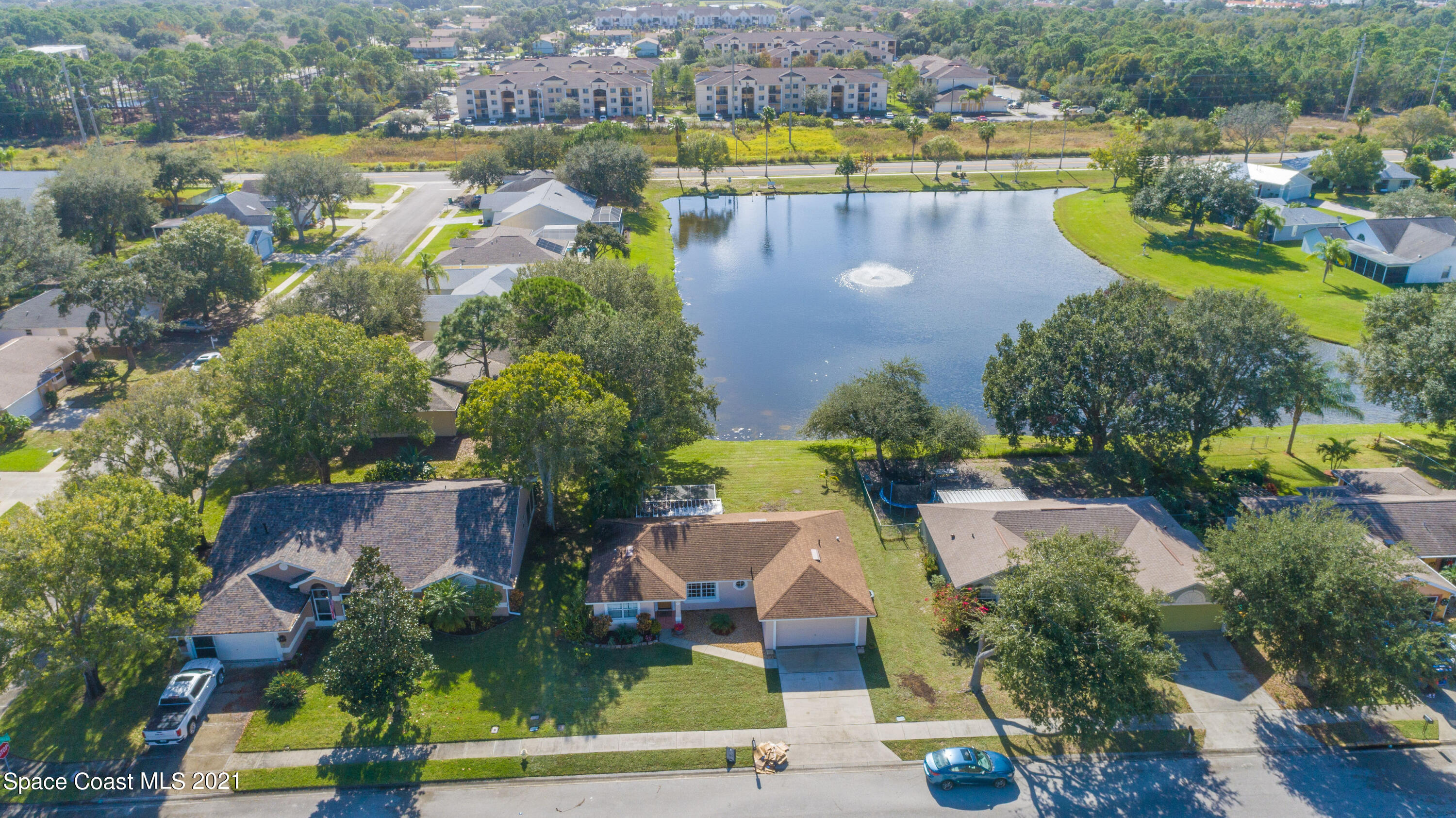 265 Oak Lake Road Melbourne, FL 32901 - Photo 20 of 25 an aerial view of a house with a lake view