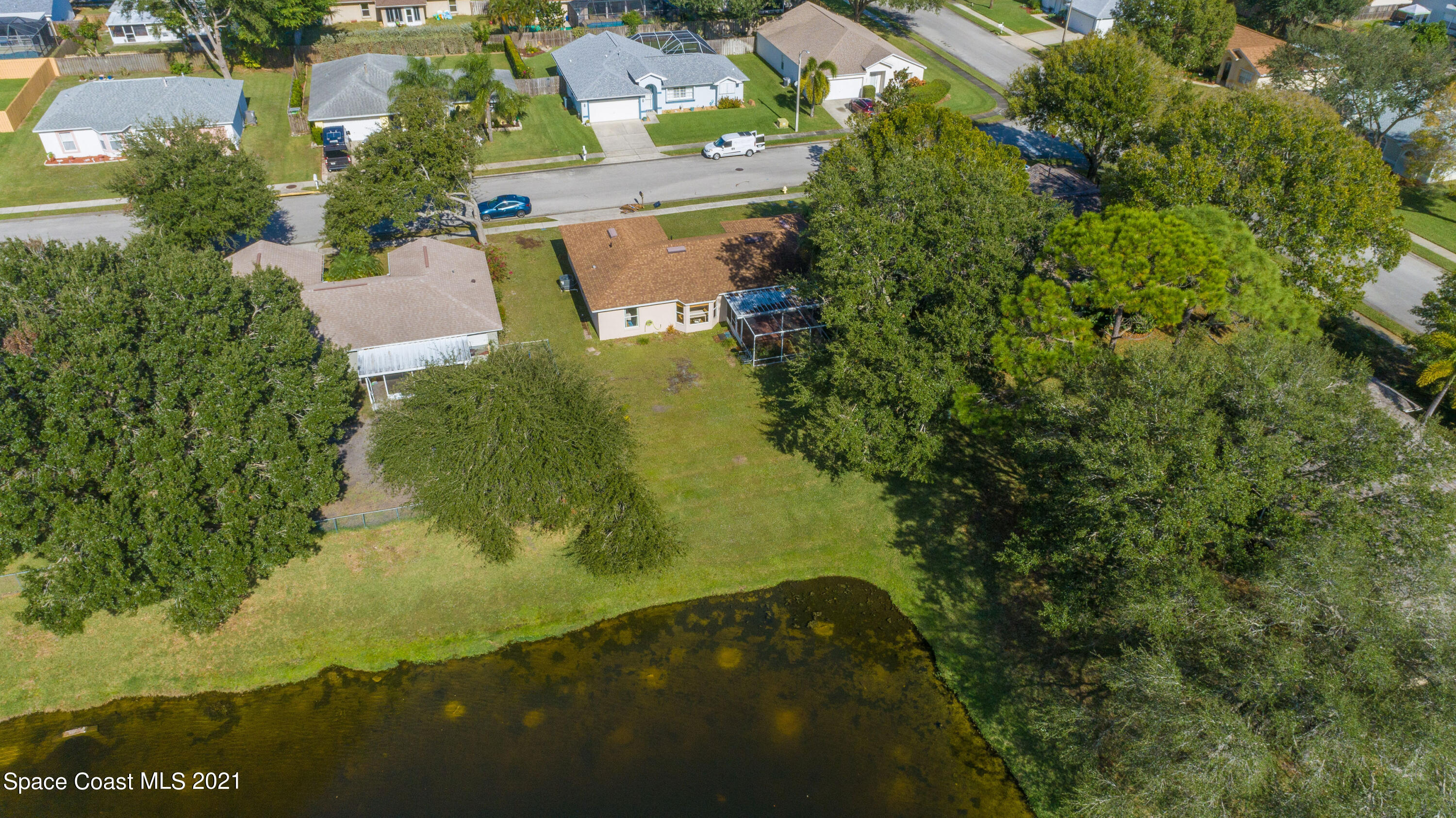 265 Oak Lake Road Melbourne, FL 32901 - Photo 22 of 25 an aerial view of residential house with outdoor space and trees all around