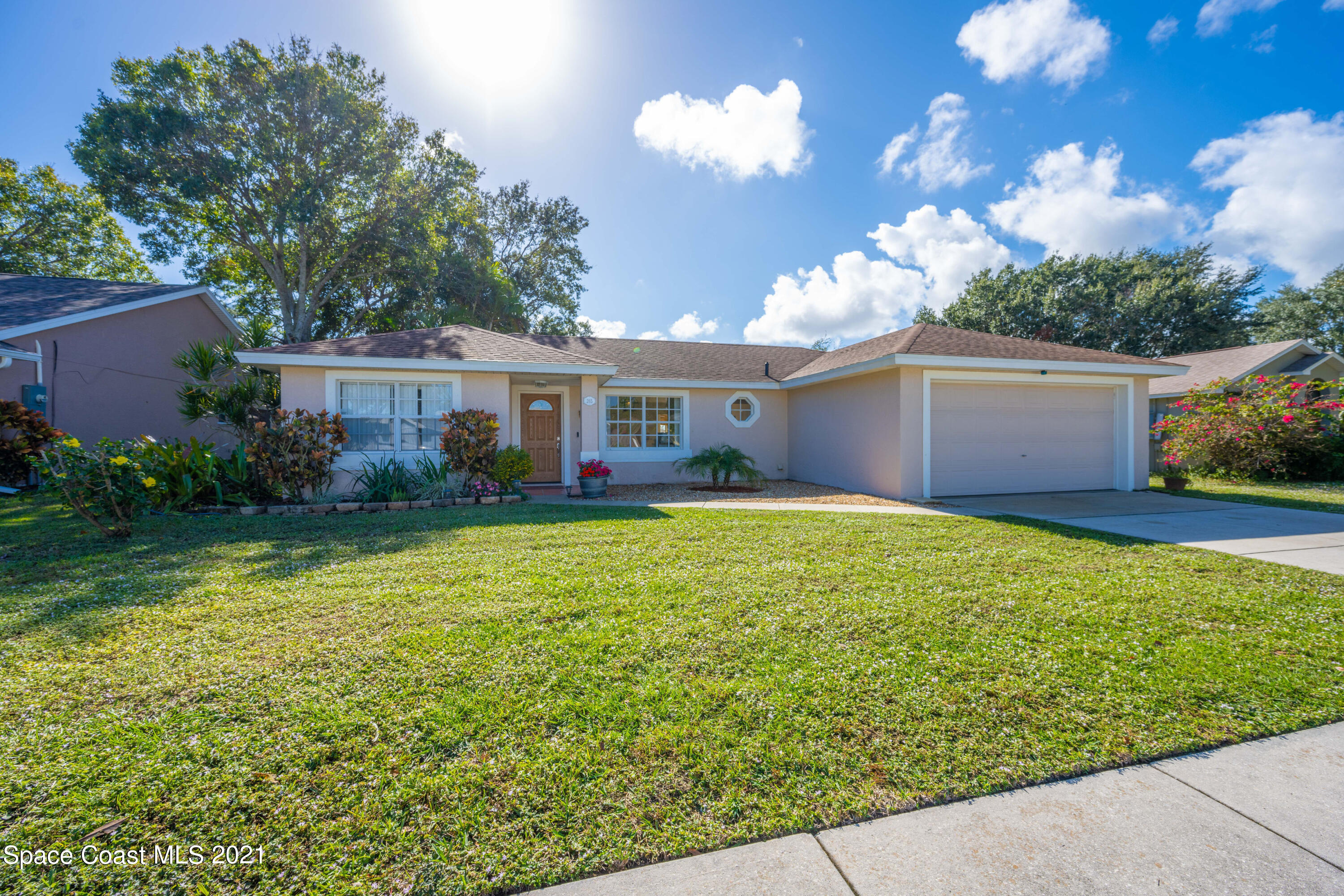 265 Oak Lake Road Melbourne, FL 32901 - Photo 23 of 25 a view of a house with a backyard porch and garden