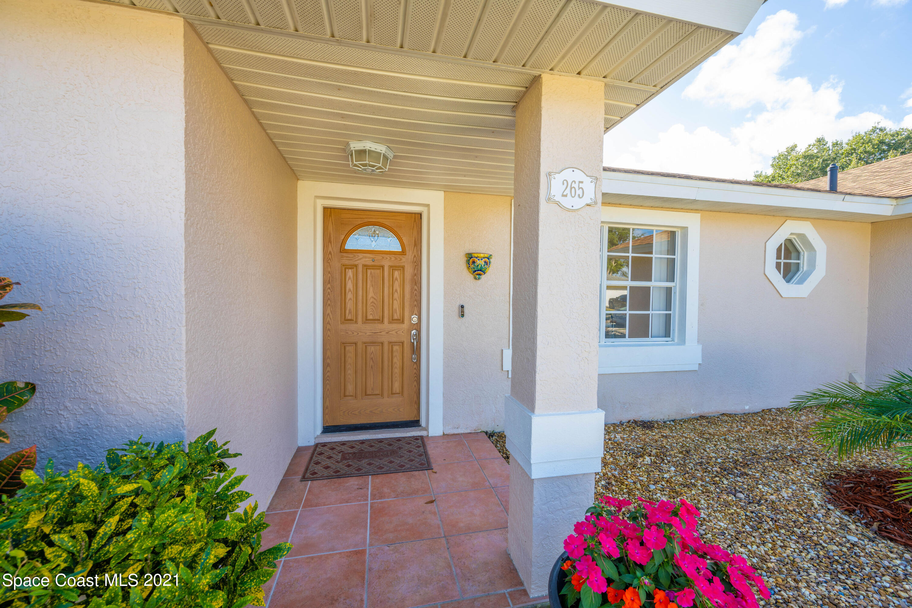 265 Oak Lake Road Melbourne, FL 32901 - Photo 24 of 25 a front view of a house with a yard