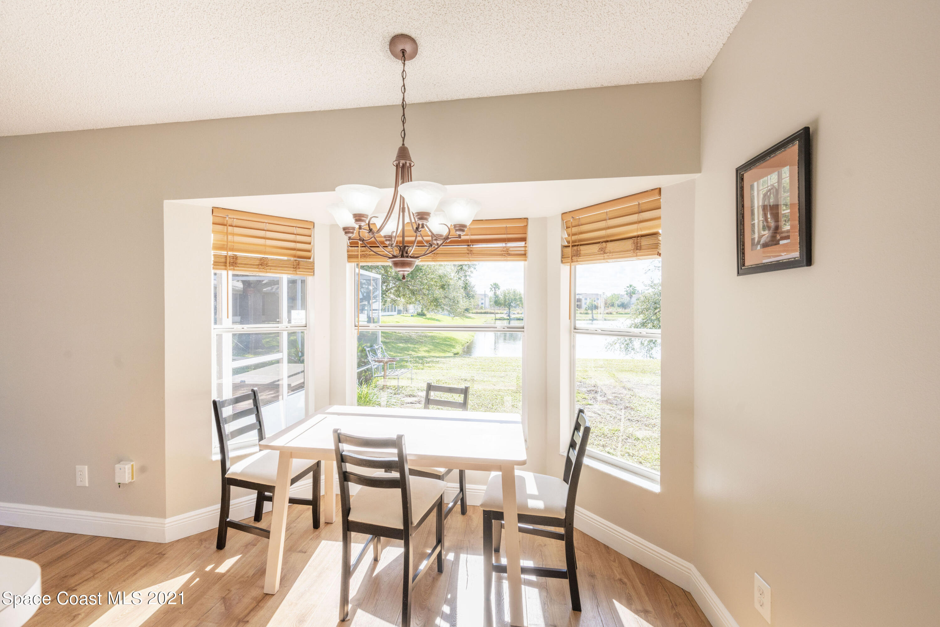 265 Oak Lake Road Melbourne, FL 32901 - Photo 7 of 25 a view of a dining room with furniture window and outside view