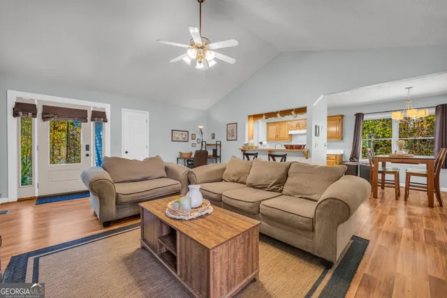 a living room with furniture and a flat screen tv