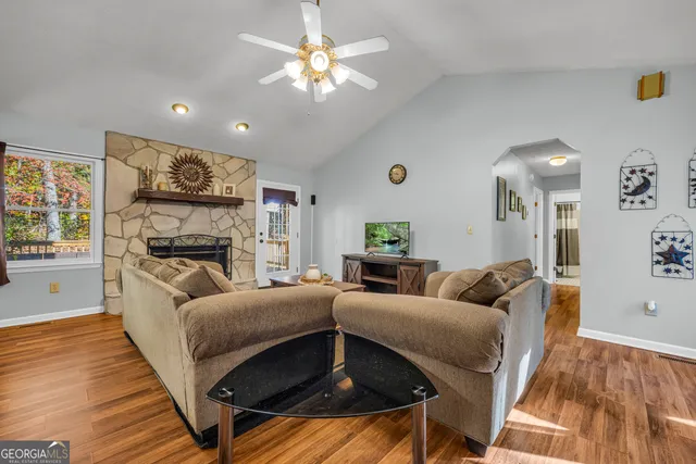 a view of a dining room with furniture and wooden floor