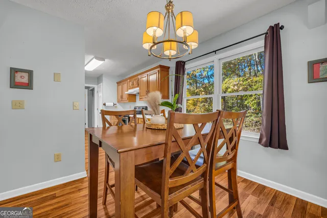 a kitchen with stainless steel appliances granite countertop a sink and a stove