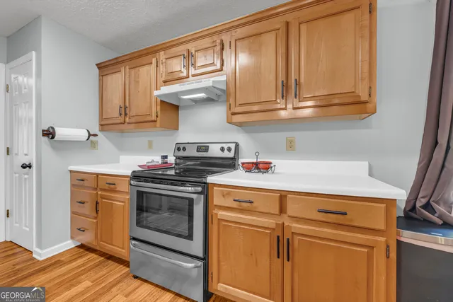 a kitchen with granite countertop lots of counter top space