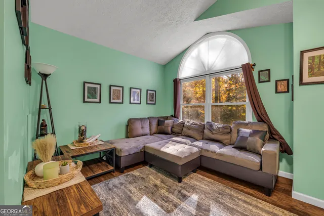 a view of a brick house with a yard