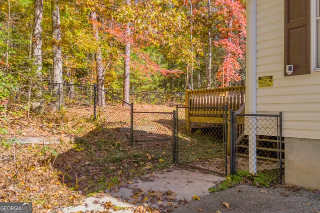 a sign that is sitting in a forest