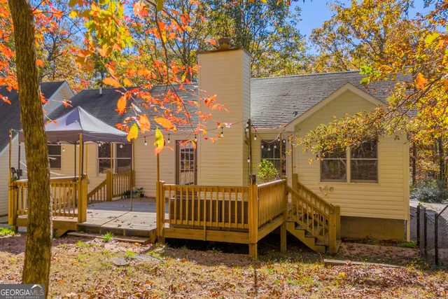 a view of an aerial view of residential houses with outdoor space and trees