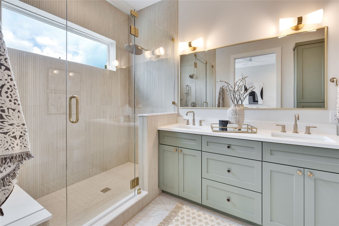 1937 East 38th 1/2 Street, Unit B Austin, TX 78723 - Photo 15 of 23 a bathroom with a shower sink vanity and mirror