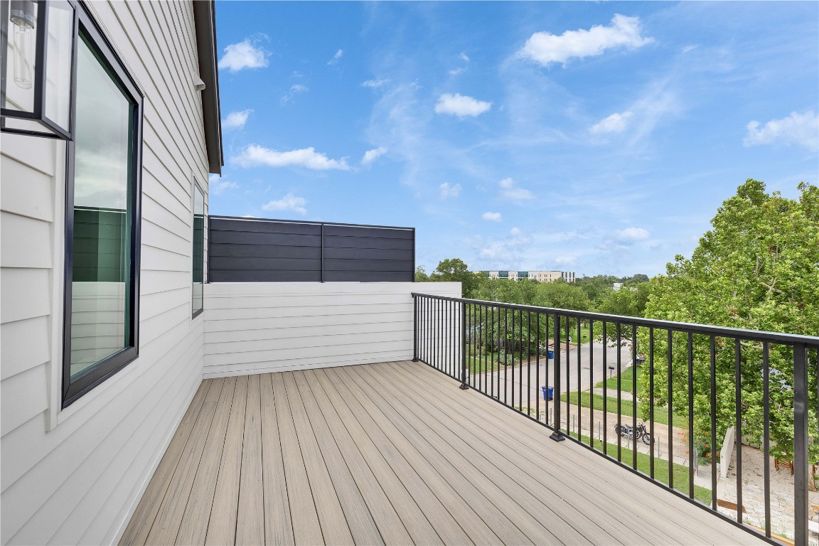 1937 East 38th 1/2 Street, Unit B Austin, TX 78723 - Photo 19 of 23 a view of balcony with wooden floor and fence
