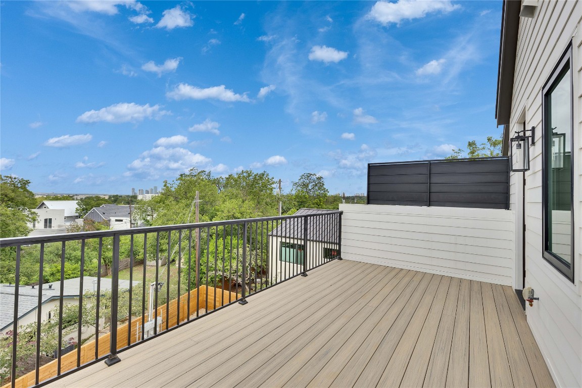 1937 East 38th 1/2 Street, Unit B Austin, TX 78723 - Photo 20 of 23 a view of a balcony with wooden floor and fence