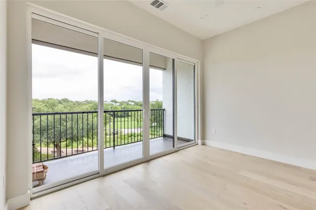 a view of a room with sliding glass door and mountain view