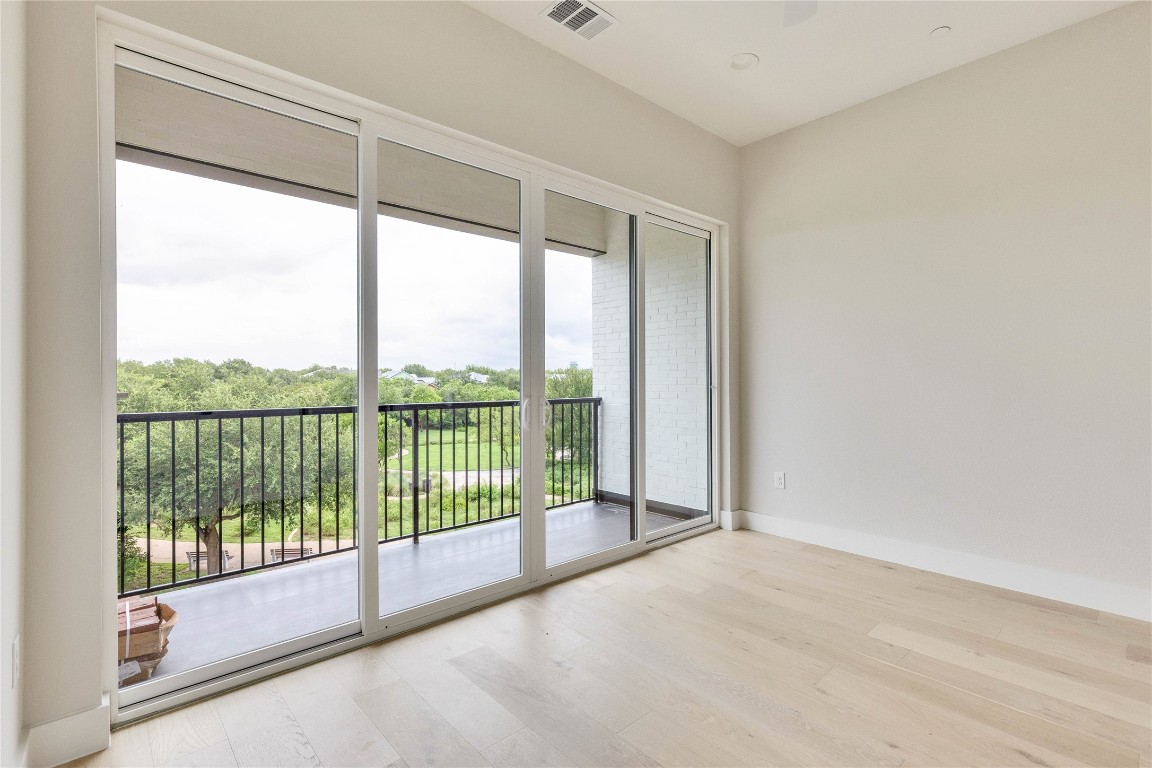 1937 East 38th 1/2 Street, Unit B Austin, TX 78723 - Photo 21 of 23 a view of a room with sliding glass door and mountain view